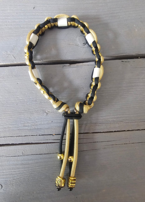 Paracord tekenband goud zwart S